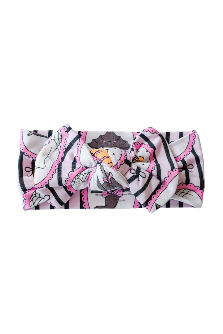 Caden Lane pink and black striped Halloween bow headband with ghost, pumpkin, and witch hat frame print