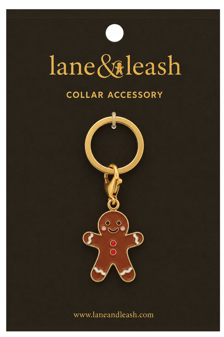 Lane & Leash gingerbread man charm collar accessory on branded packaging card, gold ring with lobster clasp and enamel gingerbread man charm