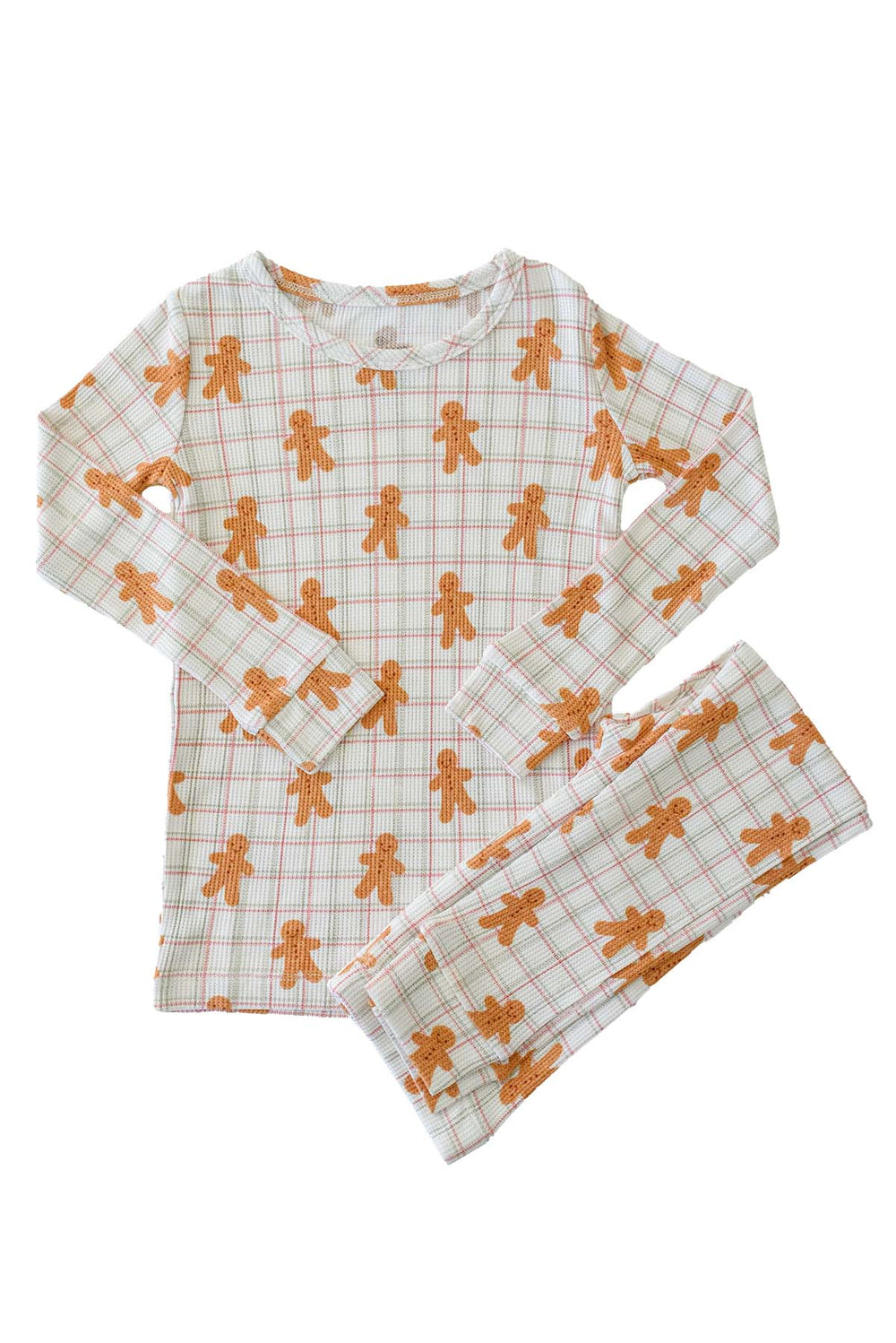 flat lay of a Caden Lane gingersnap bamboo waffle two-piece pajama set featuring a gingerbread print top and pants