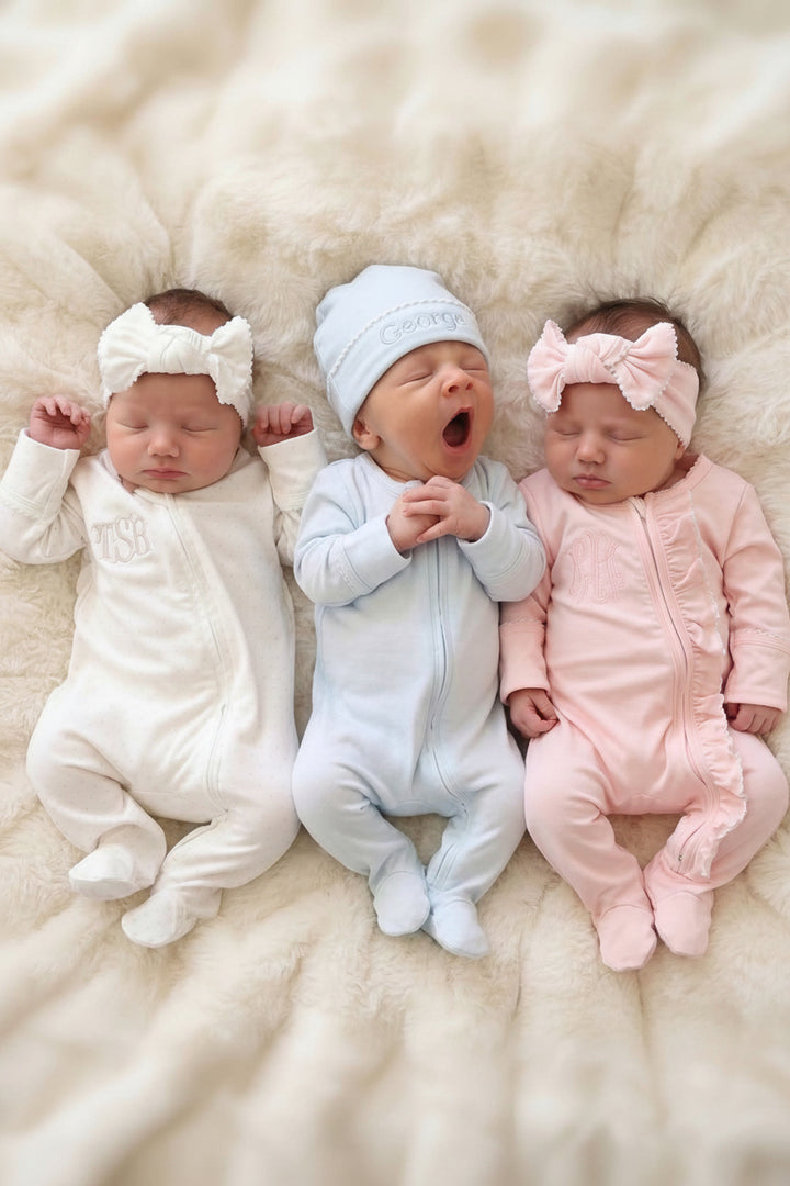 babies in picot trim outfits with matching bow headwraps