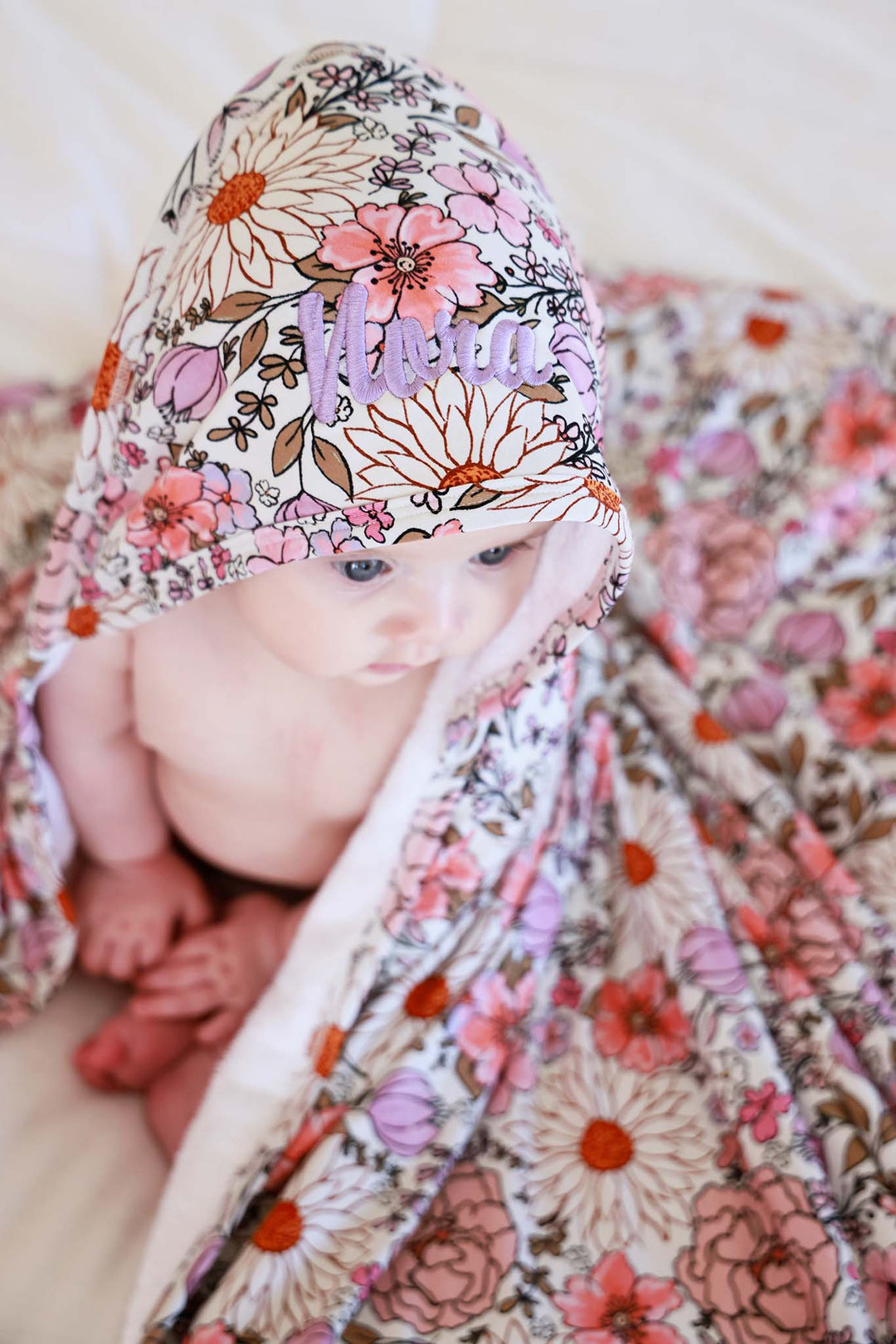 top view of embroidered purple floral towel