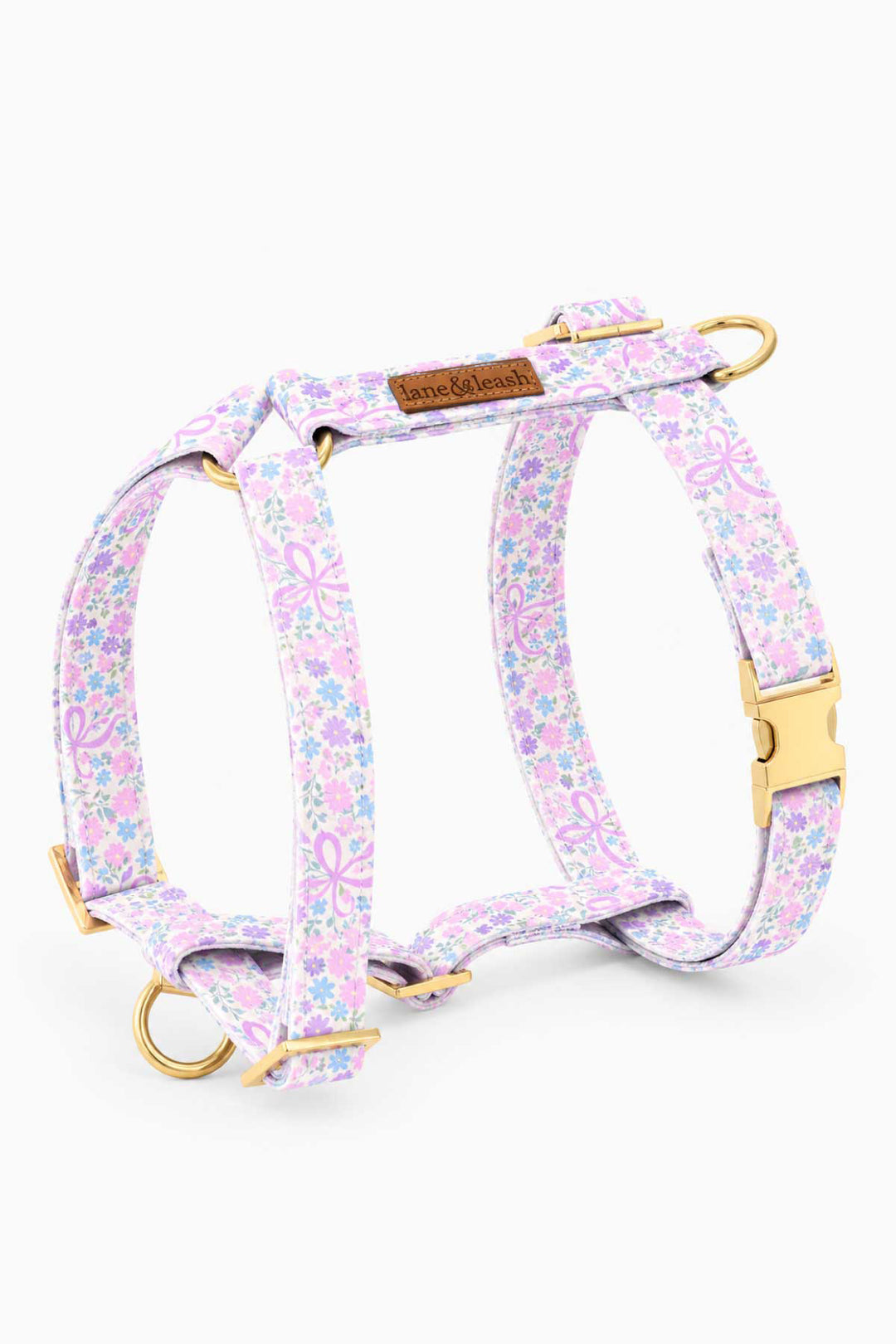 Ribbon Garden strap dog harness — H-style design in pink and lavender floral print with gold hardware and D-ring attachment points — shown flat on white background