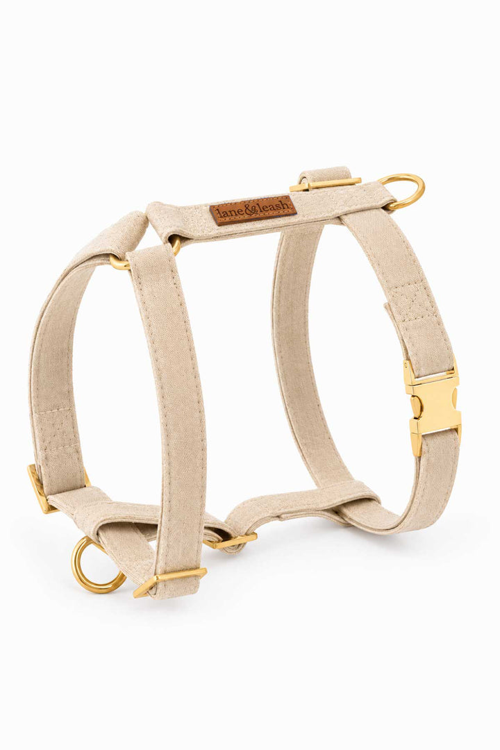 Caden Lane sand dune strap dog harness in beige flax fabric with H-style design and gold hardware, on white background