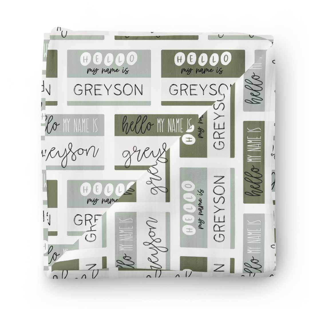 hello my name is green block swaddle 