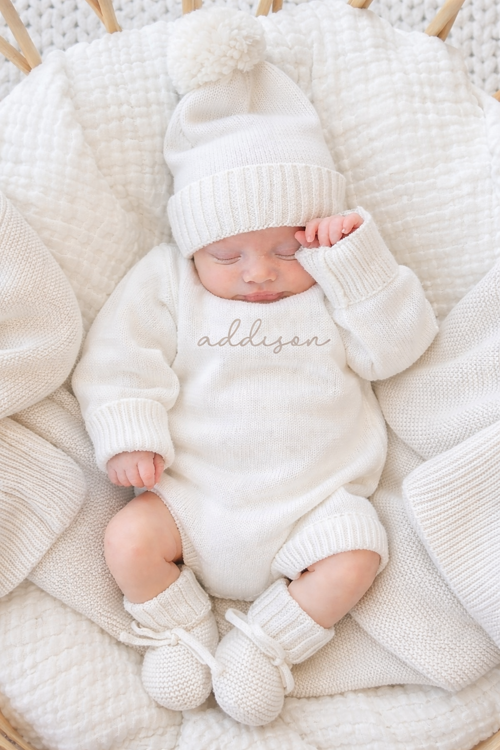 Baby wearing a Personalized Printed Knit Sweater Bubble in the color Ivory, with matching beanie and booties