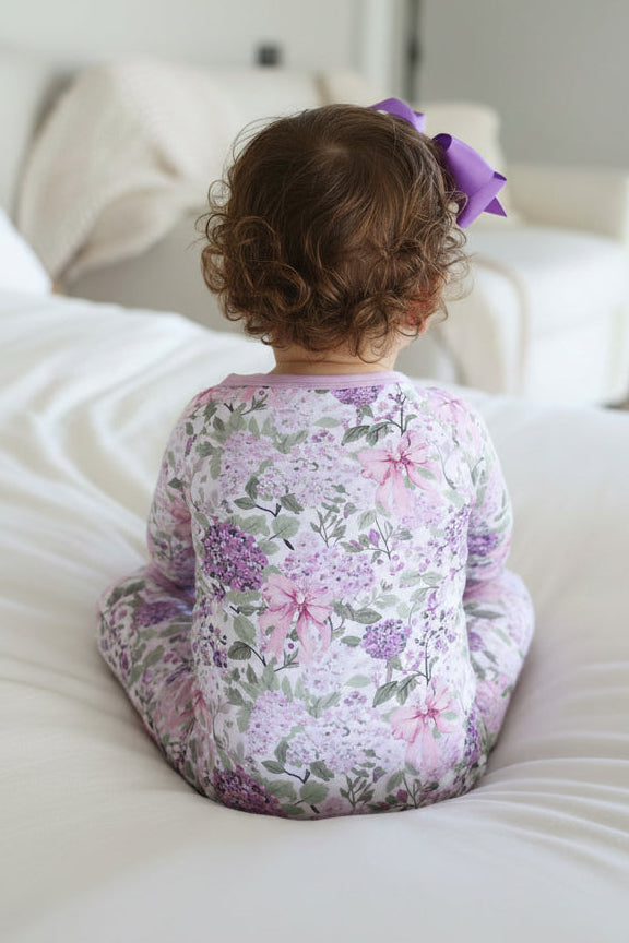 back view of lavender lullaby convertible zip romper 