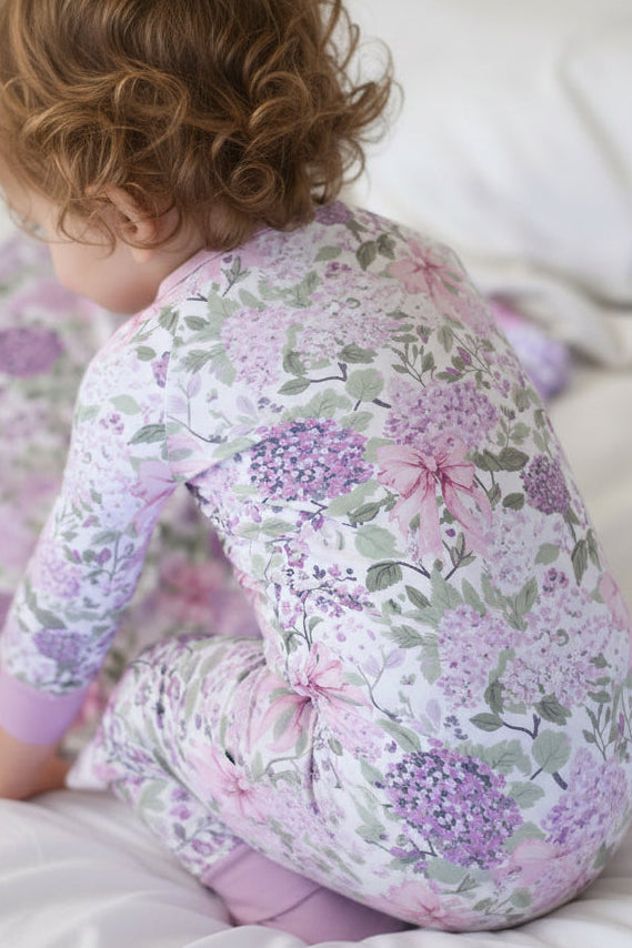 closeup of lavender lullaby print in convertible zip romper style