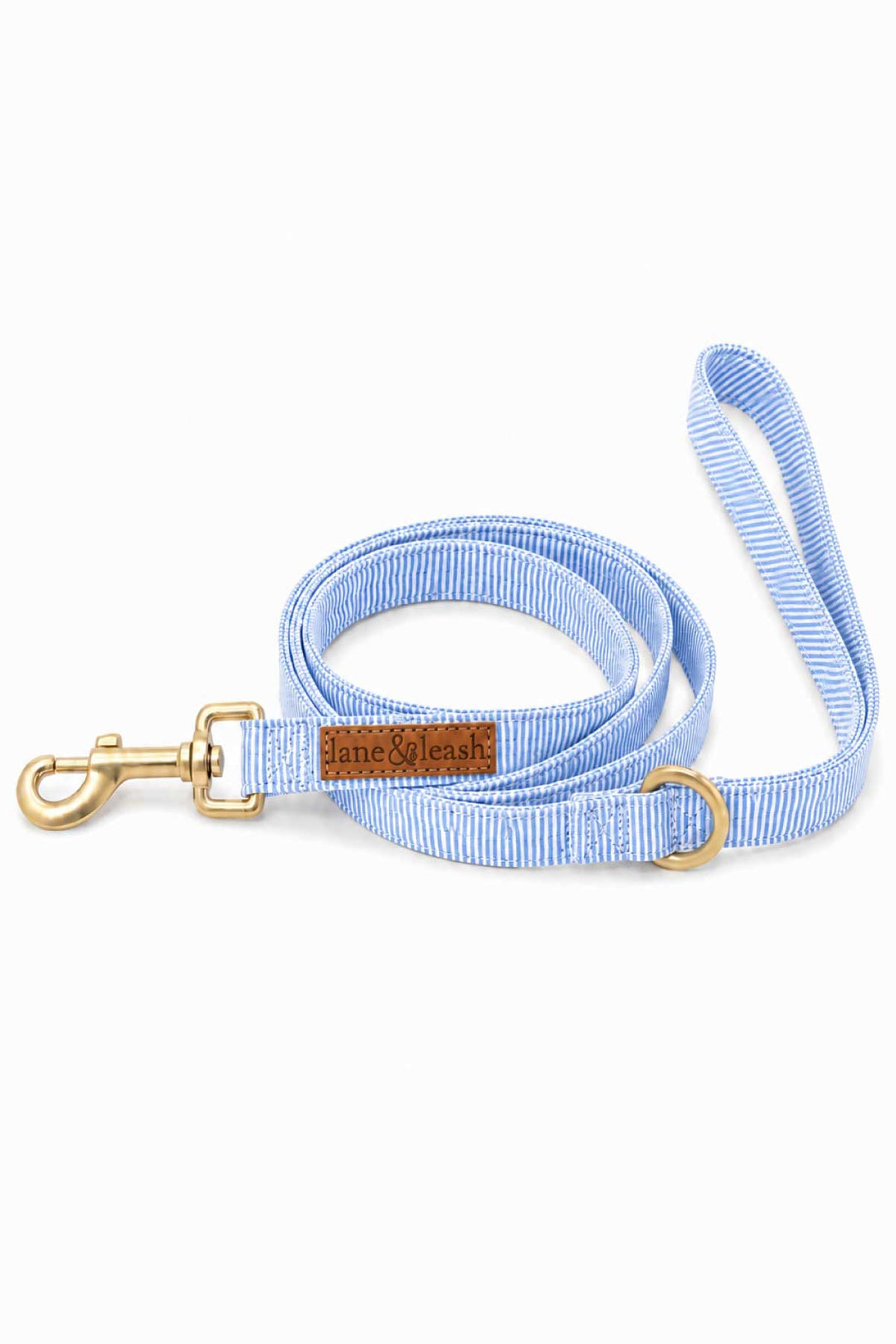Morning Mist light blue and white pinstripe dog leash coiled showing gold swivel clasp, D-ring, and brown leather Caden Lane tag, product shot on white background