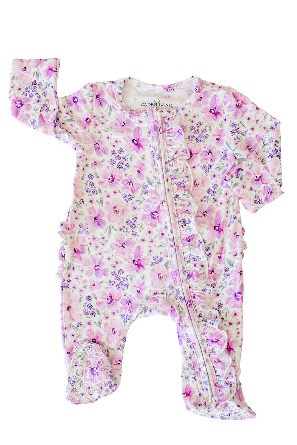 Flat lay of the front of a Caden Lane white knit ruffle footie in a Lilac Dreams print featuring pink watercolor blooms and tiny purple florals.