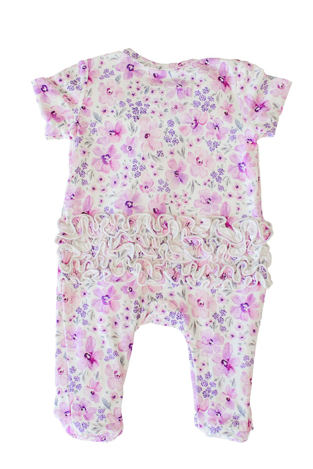 Back view of a flat-laid Caden Lane white knit ruffle footie with tiered rear ruffles in a Lilac Dreams print featuring pink and purple watercolor flowers.