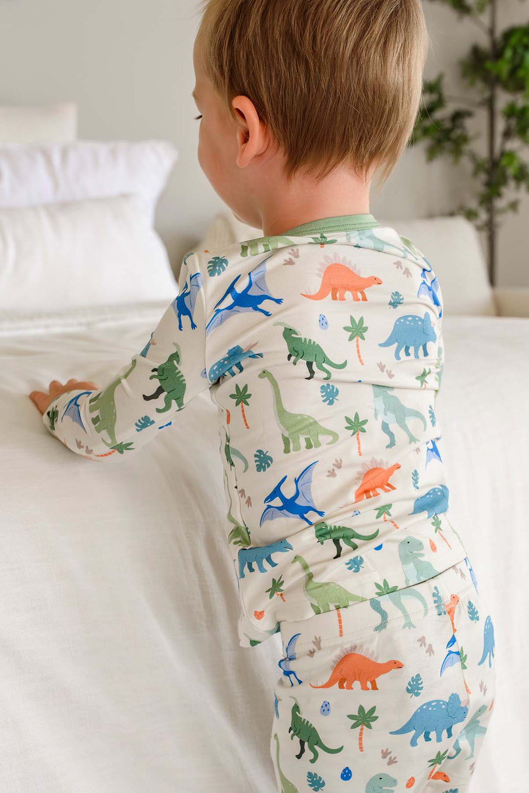 blue, orange and green dinosaur pajama set with palm trees 