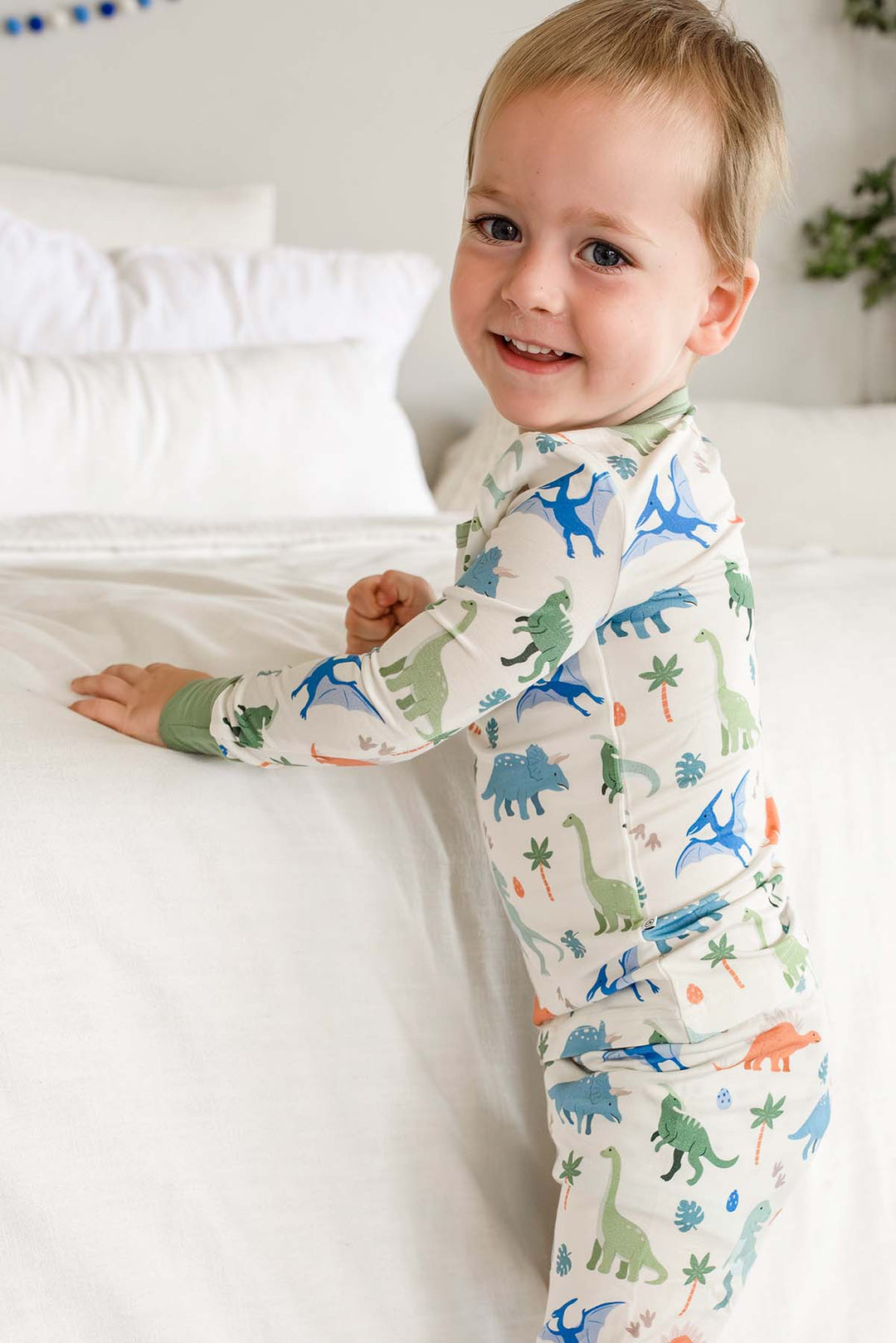 side view of little fossil neutral two piece pajama set 