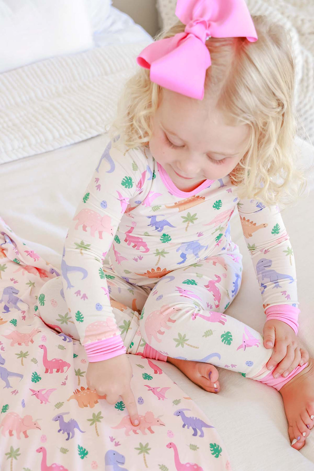 little fossil two piece pajama set for girls with a matching pink ribbon clip bow 