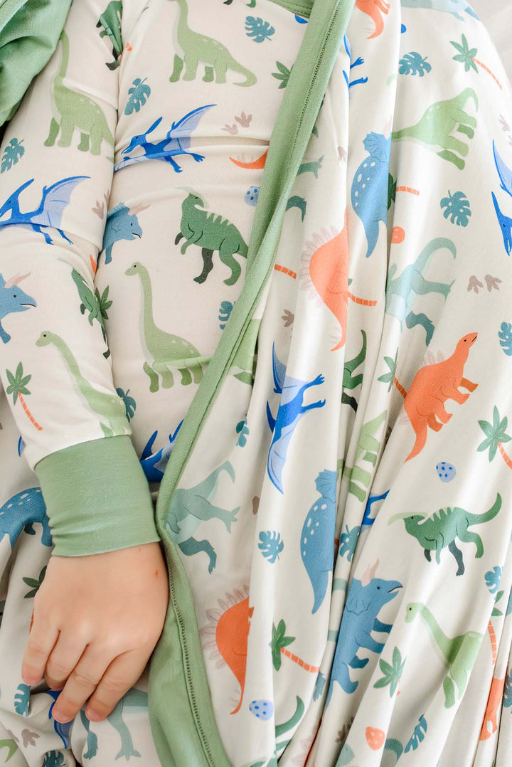 closeup of little fossil neutral bamboo blanket and pajama set