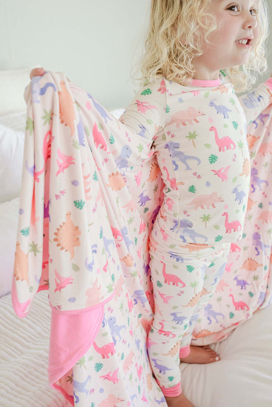 girl standing on bed little fossil pink double sided bamboo