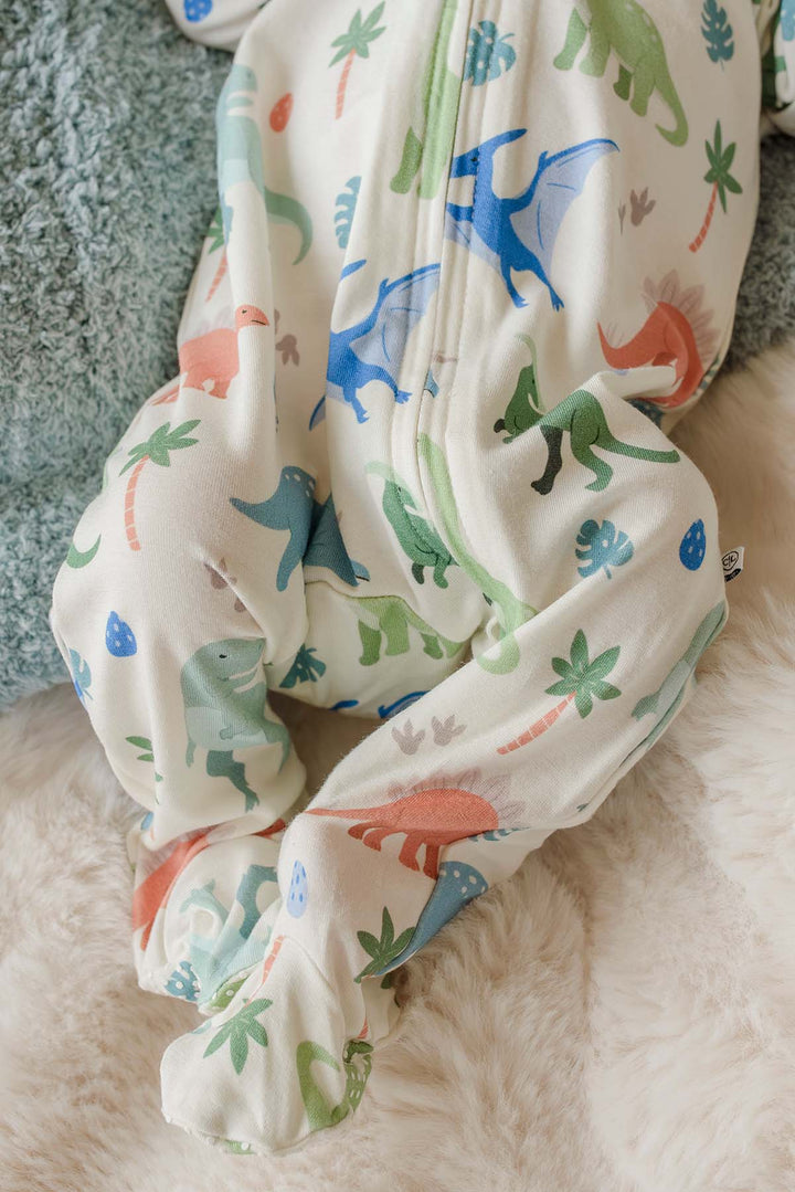 closeup of little fossil neutral zipper footie