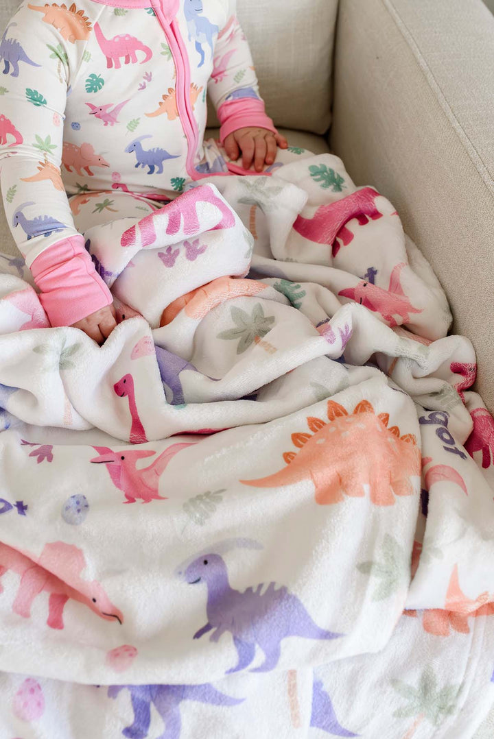 personalized blanket for girls with minky fabric in pink dinosaur print 
