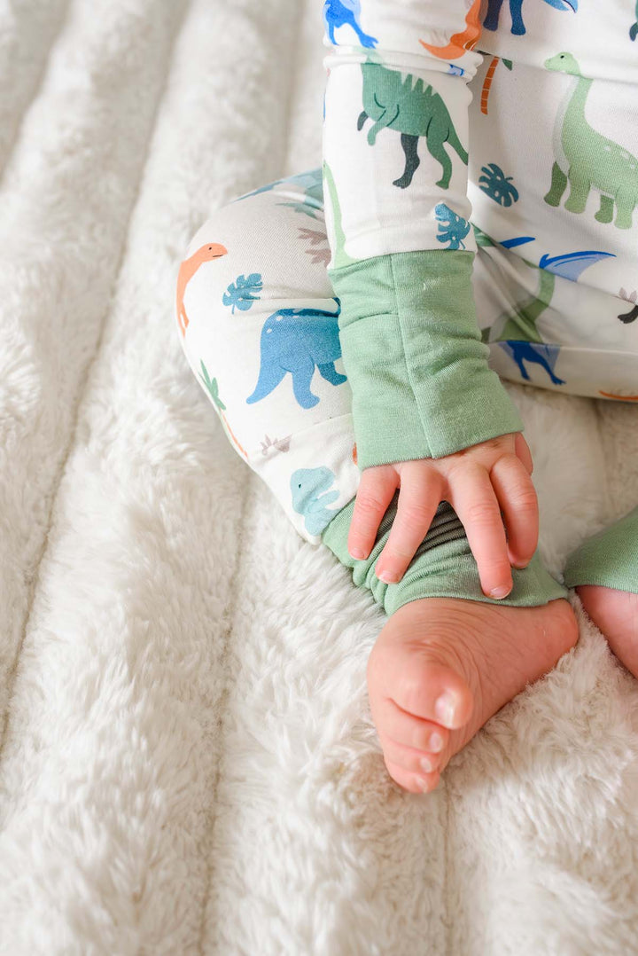 closeup of cuffs on little fossil neutral convertible zip romper