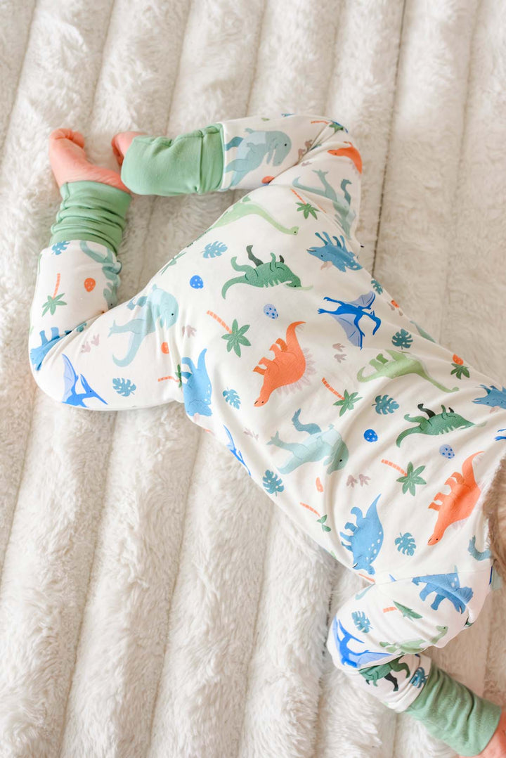 back view of little fossil neutral convertible zip romper for boys 