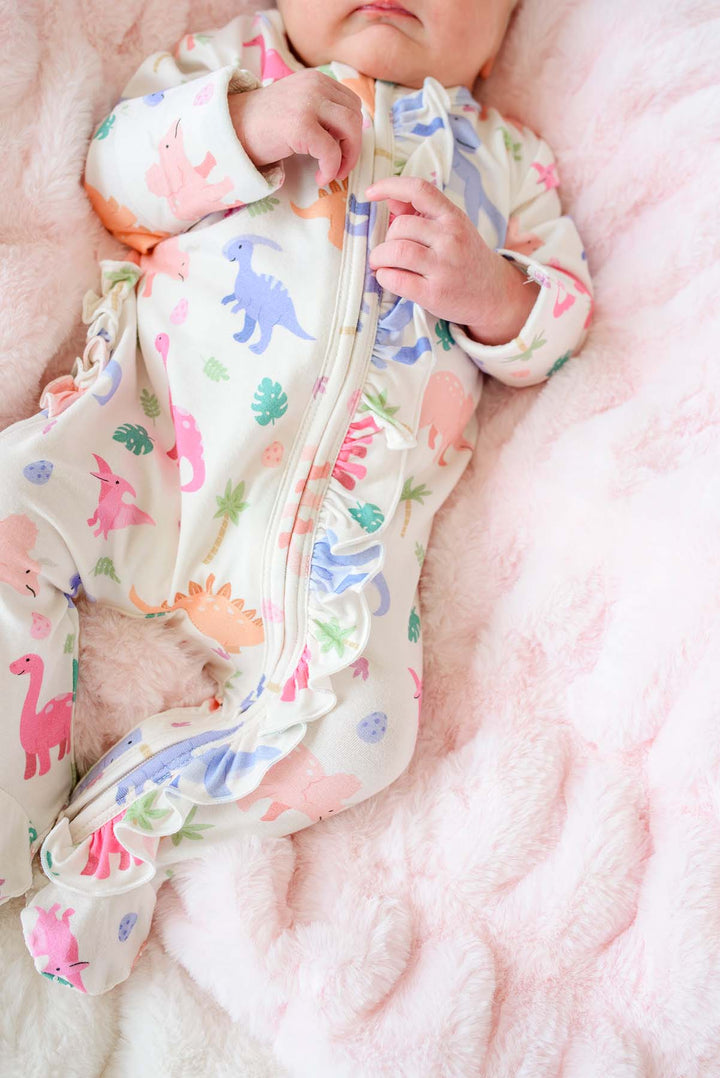 closeup of pink little fossil ruffle zipper footie 