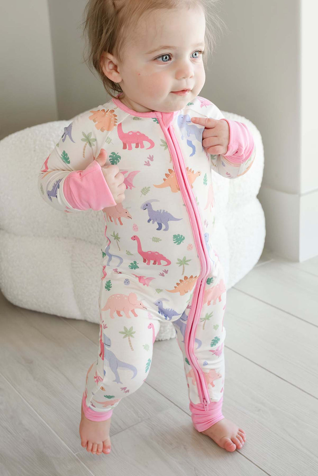walking toddler girl in little fossil pink convertible zip romper 