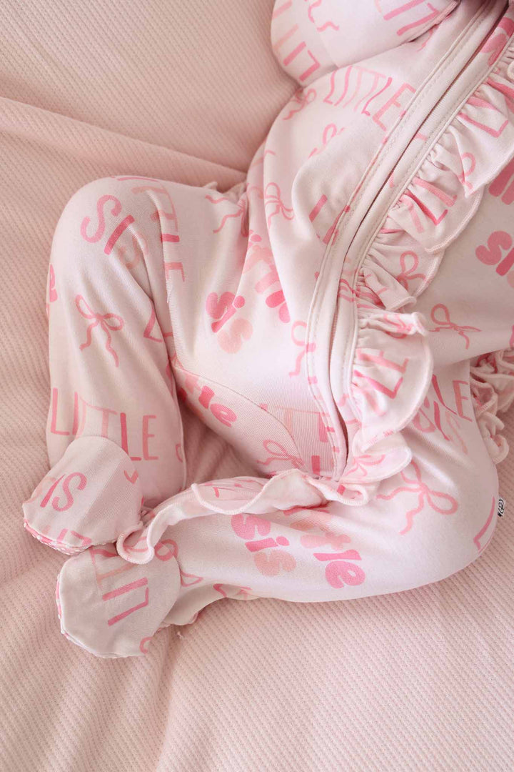 closeup of little sis ruffle zipper footie pajama for baby girls 