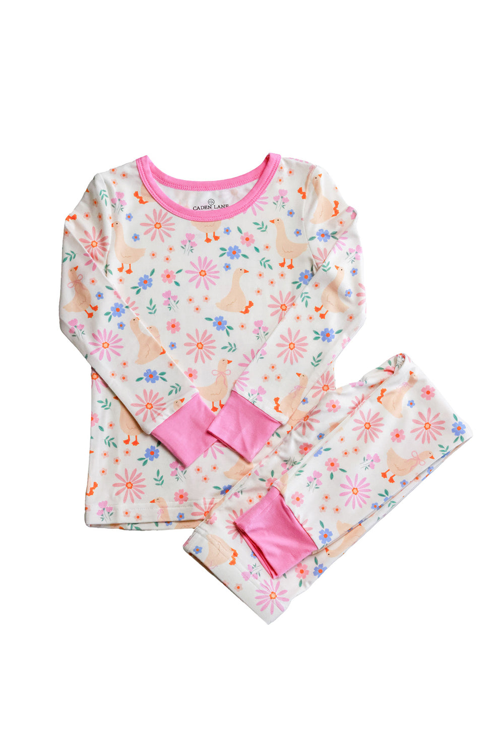 Lucy Goosy Two Piece Pajama Set flat lay showing the long sleeve top and pants in the floral duck print with pink trim cuffs on a white background