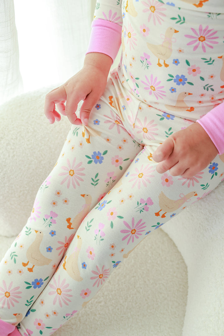Close-up detail of the Lucy Goosy Two Piece Pajama Set pants showing the floral duck print and pink cuff trim detail