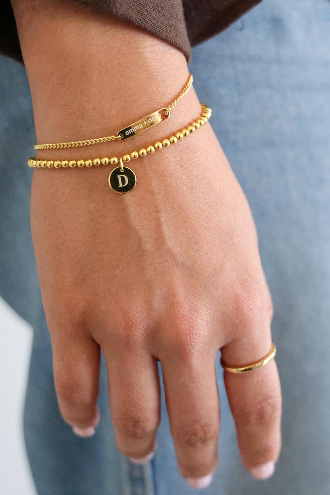 beaded circle charm and bar bracelet in gold