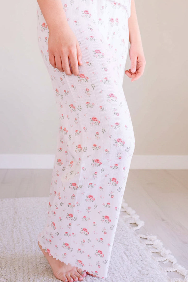 Caden Lane Rose Garden pointelle pajama pants, close-up of white floral pattern on woman's matching mommy and me pajamas
