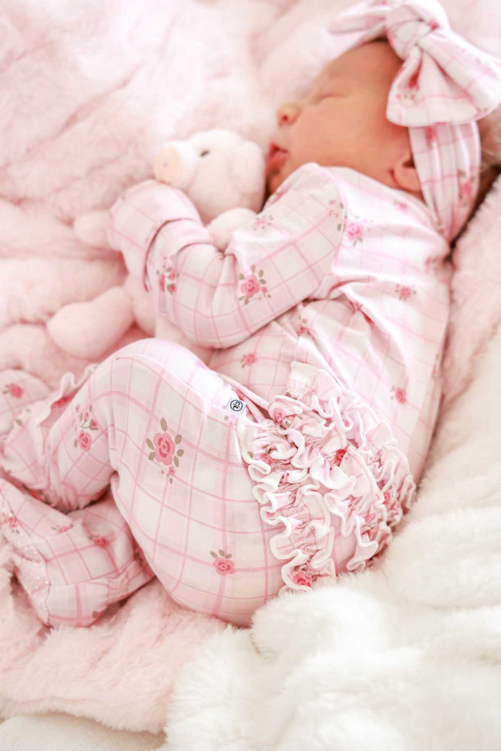 Close-up of ruffled pajama bottom detail in Primrose Plaid print