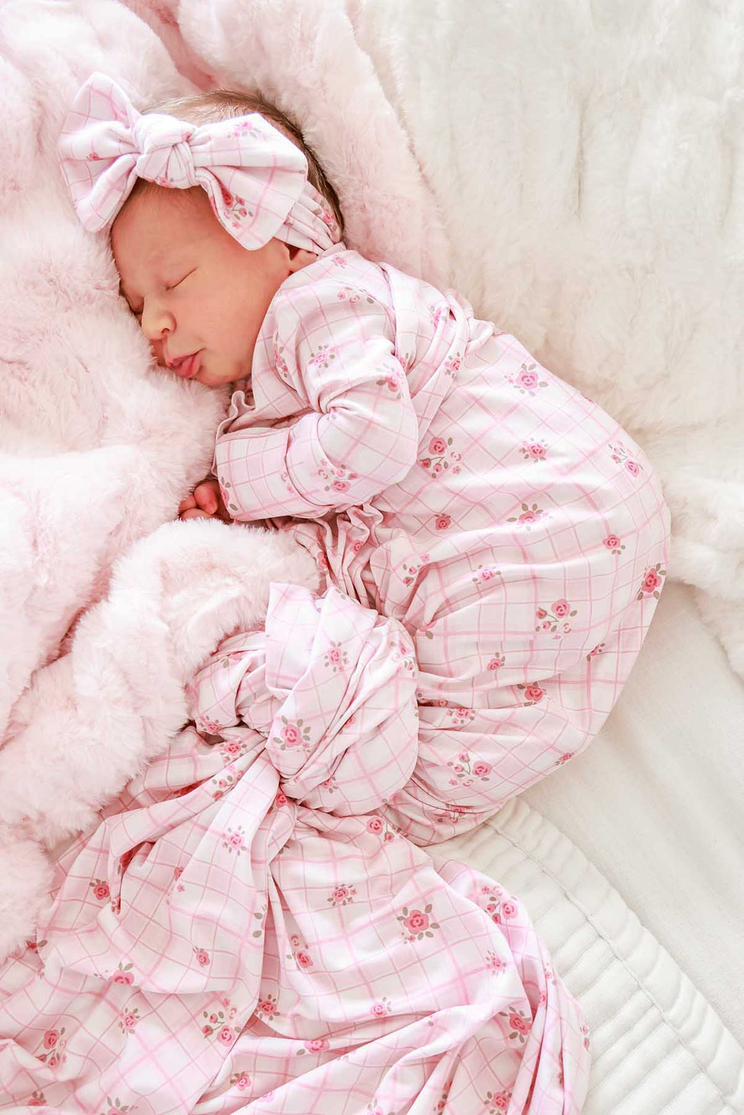 Sleeping baby swaddled in Primrose Plaid blanket with matching headwrap