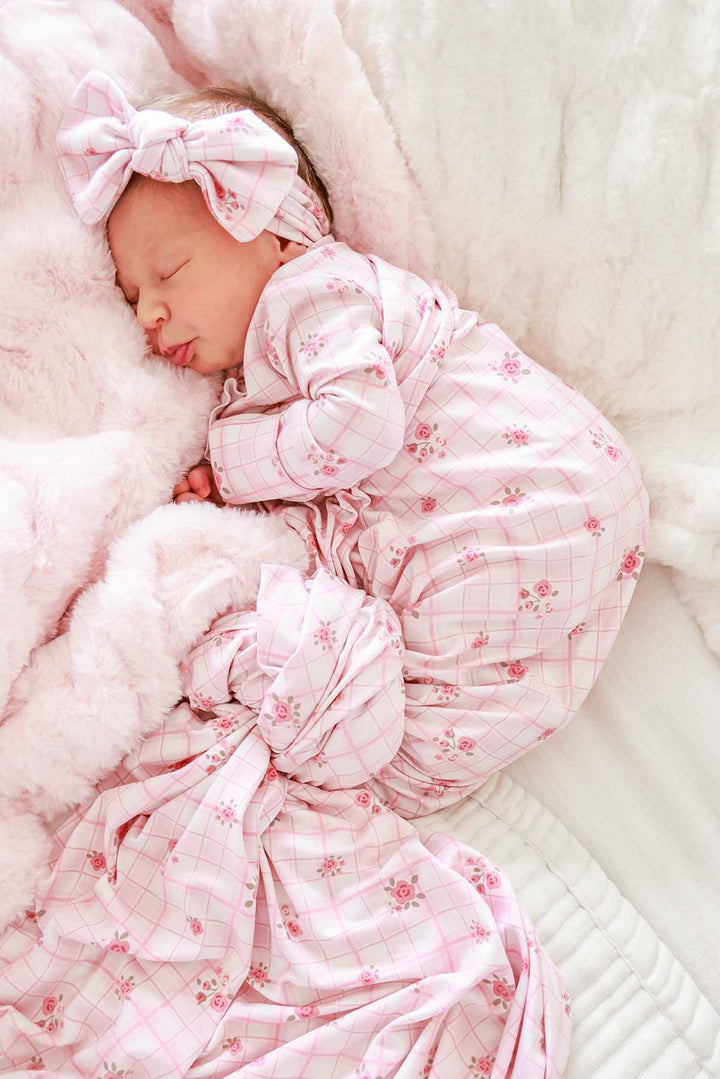Sleeping baby swaddled in Primrose Plaid blanket with matching headwrap