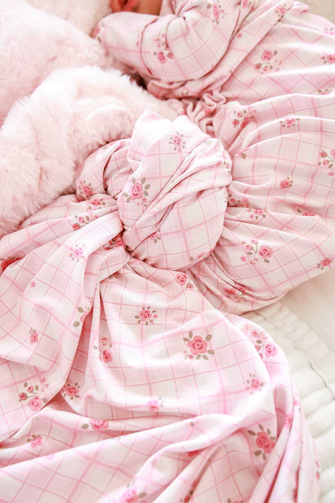 Close-up of swaddle knot texture in Primrose Plaid floral print