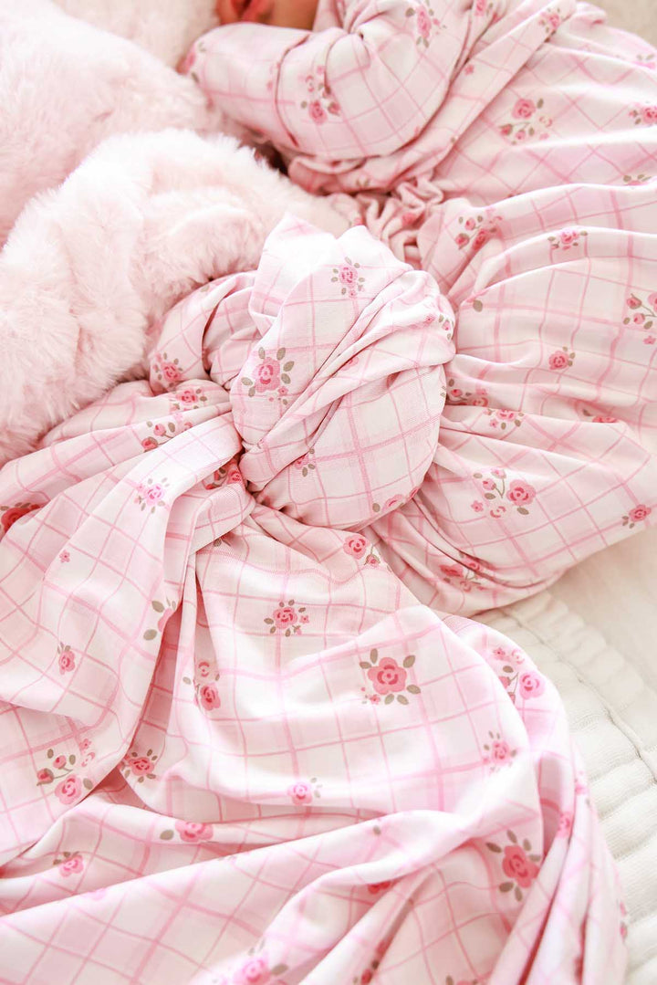 Close-up of swaddle knot texture in Primrose Plaid floral print