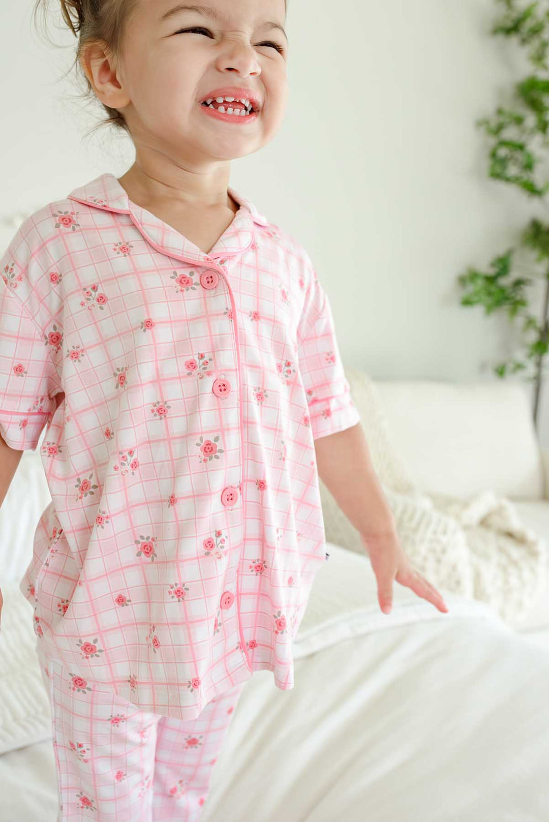 Mother and daughter smiling warmly in Primrose Plaid matching pajamas