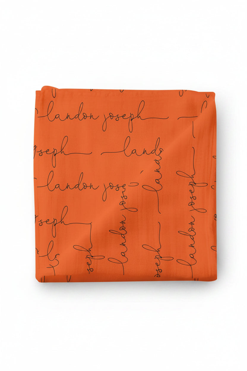 orange and black personalized swaddle script 