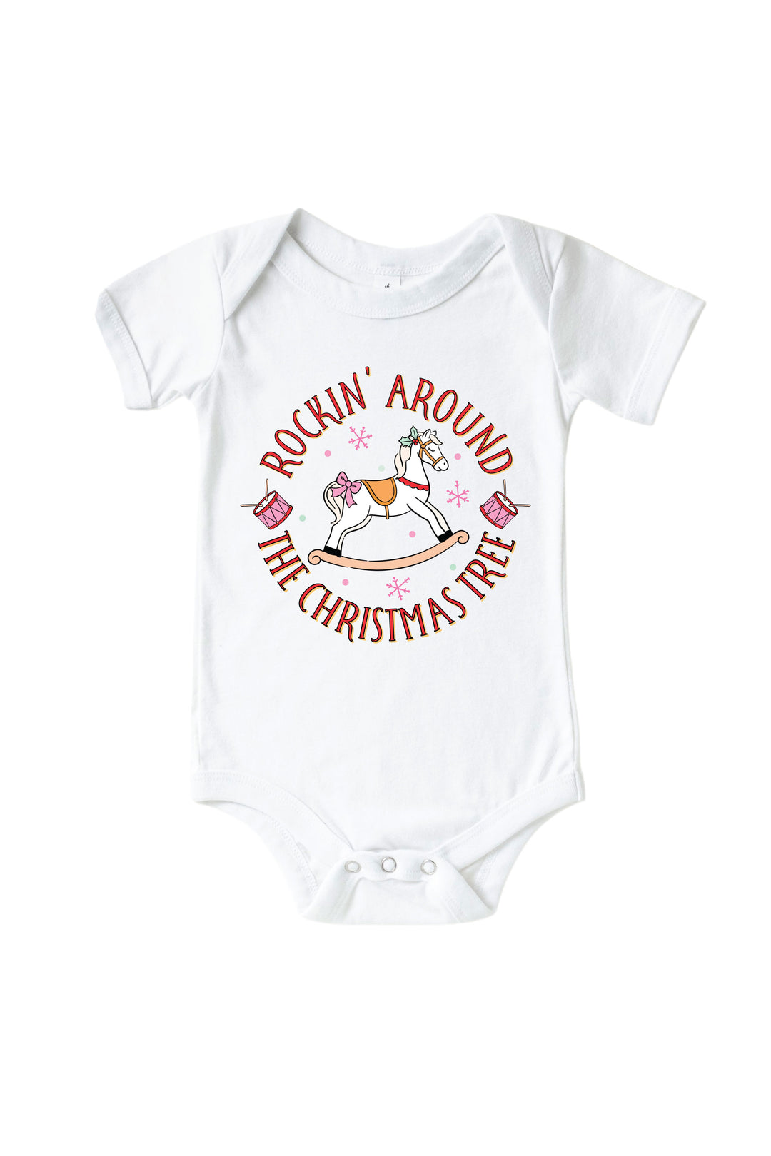 Caden Lane's white "Rockin' Around the Christmas Tree" baby onesie featuring a pink rocking horse with drums and snowflakes, laid flat.