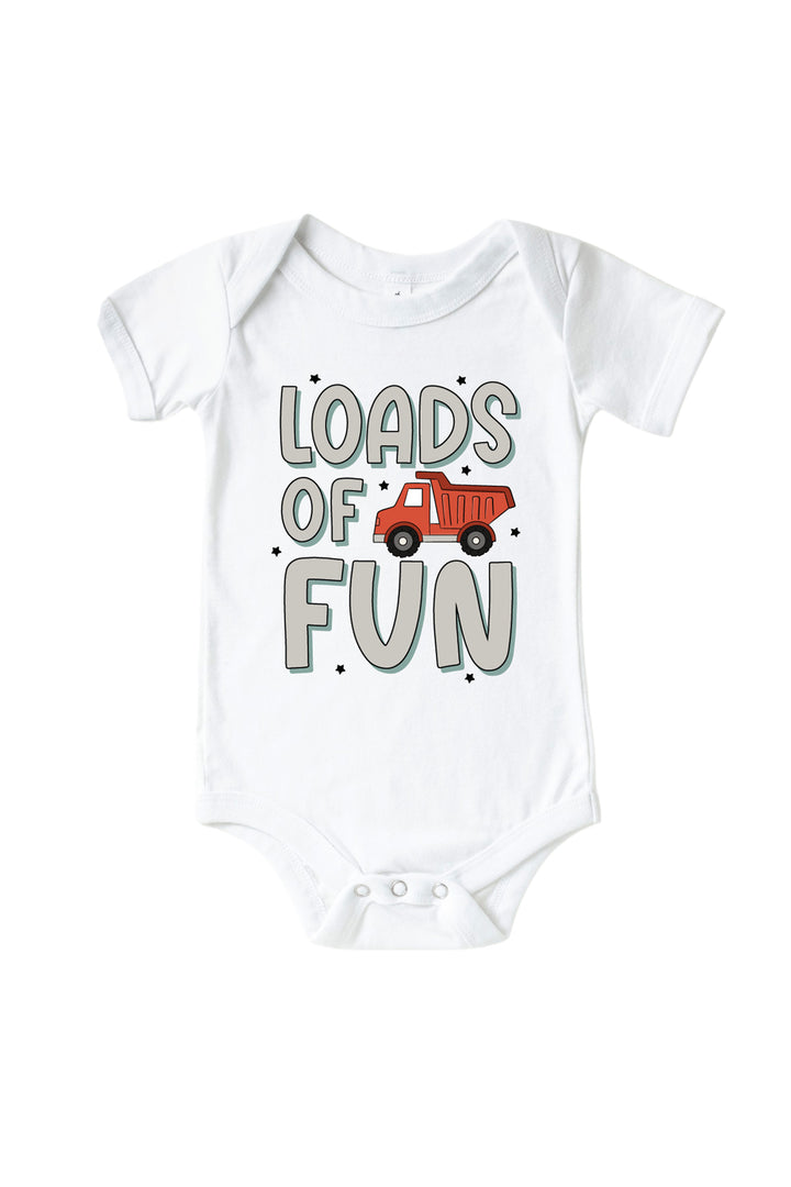 Flat lay of a Caden Lane white short-sleeve bodysuit in a Busy Builder print featuring a single red dump truck beside the words "Loads of fun."