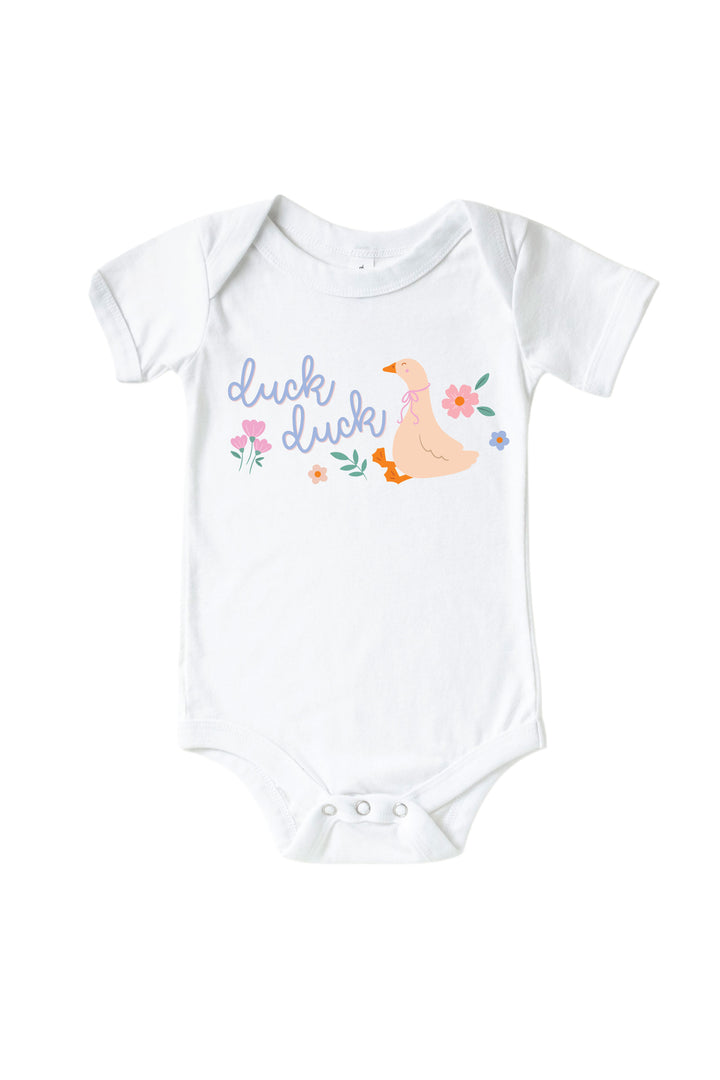 White baby bodysuit mockup with Duck Duck graphic featuring a goose with flowers and script text on a white background