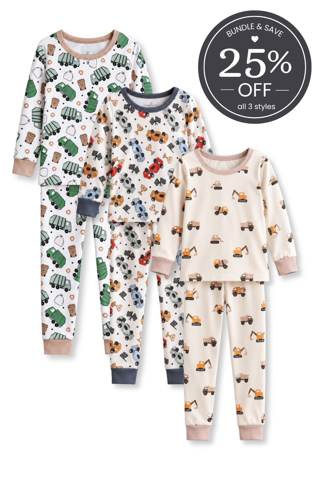 Flat lay of three Caden Lane two-piece pajama sets in garbage truck, race car, and construction vehicle prints.
