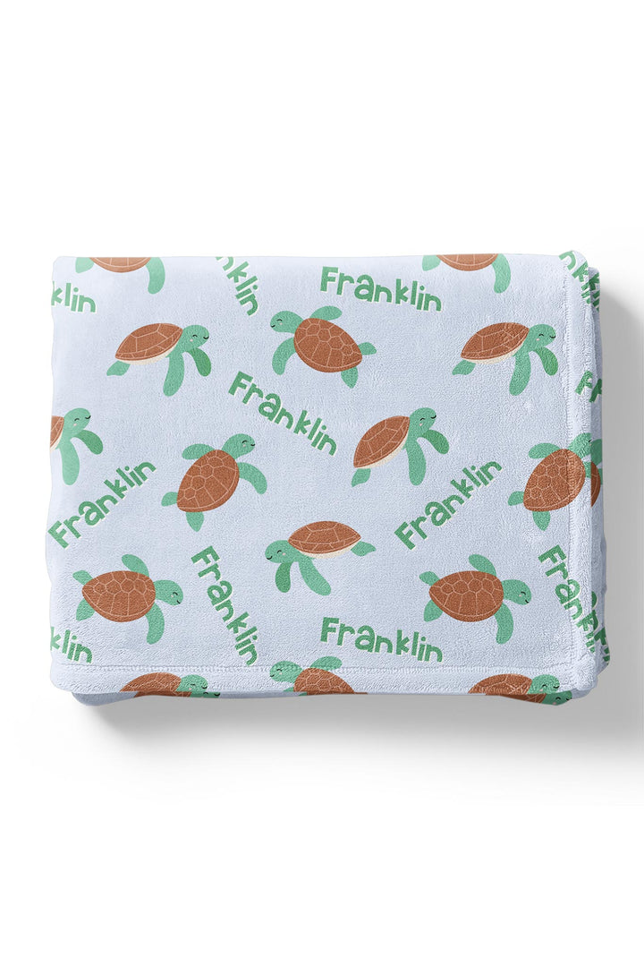 coastal cruisers personalized kids blanket folded to show turtle ocean design