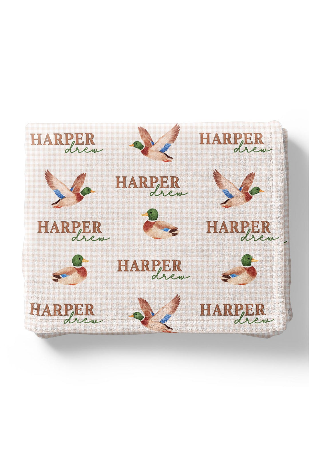 Folded personalized little mallard duck print kids blanket showing repeating mallard duck and name pattern on minky fabric