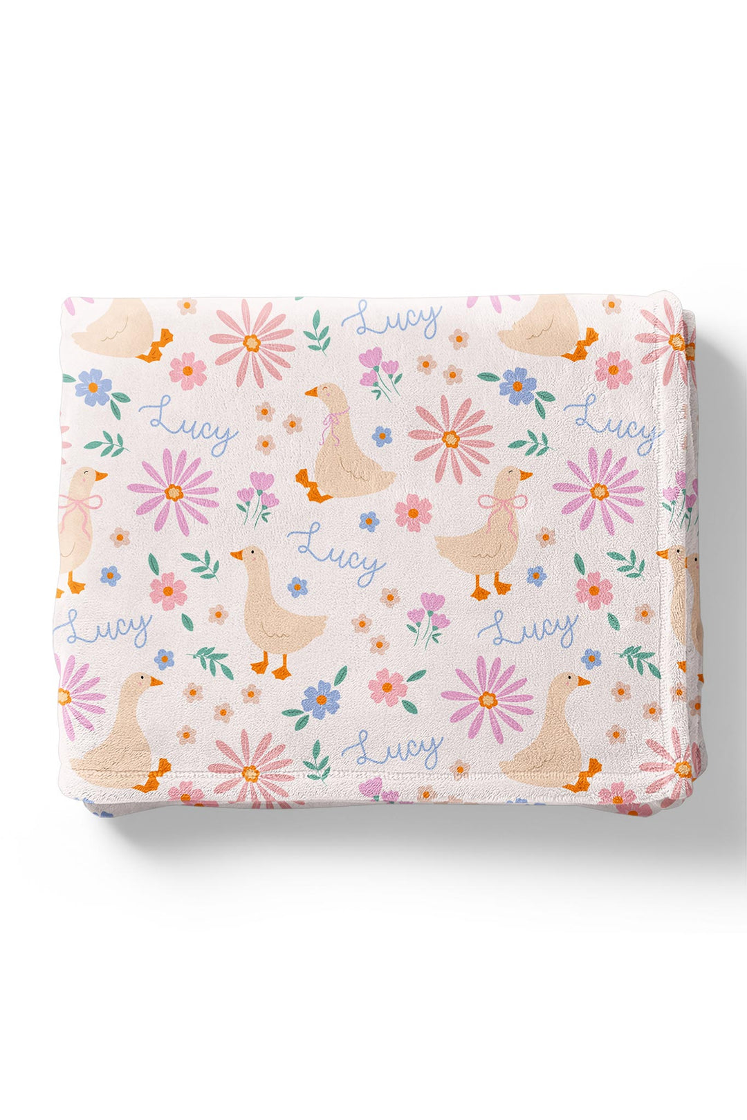 Personalized Kids Blanket in the Lucy Goosy duck and floral print folded neatly, showing the name Lucy printed throughout the design on a white background