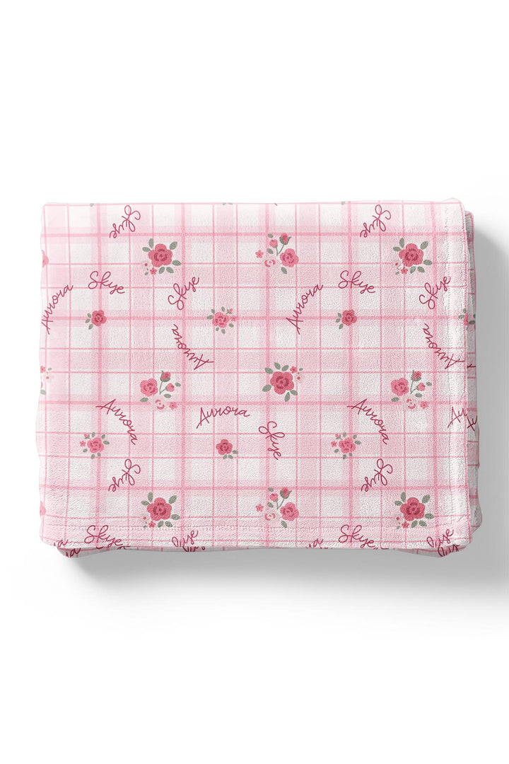 Personalized Primrose Plaid blanket folded showing repeated name print
