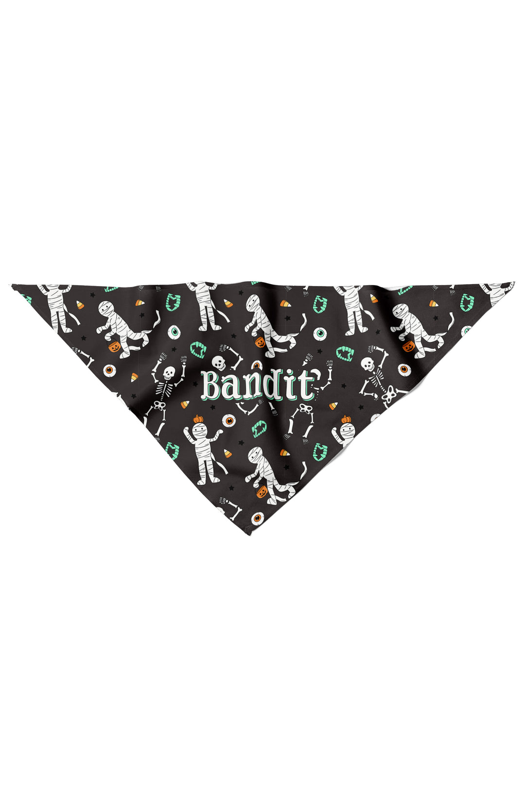 Flat lay of a black dog bandana personalized with the name 'Bandit' and Halloween mummy and skeleton graphics.