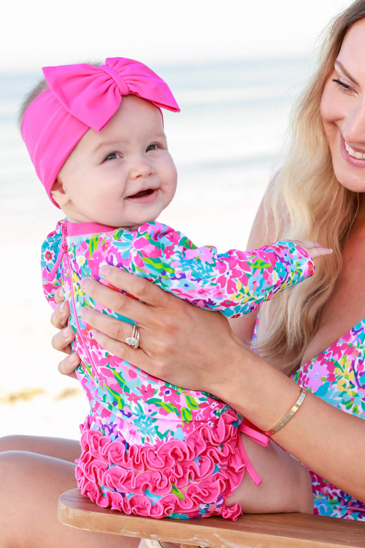 petal splash long sleeve rash guard with ruffle bottom with matching pink swim bow