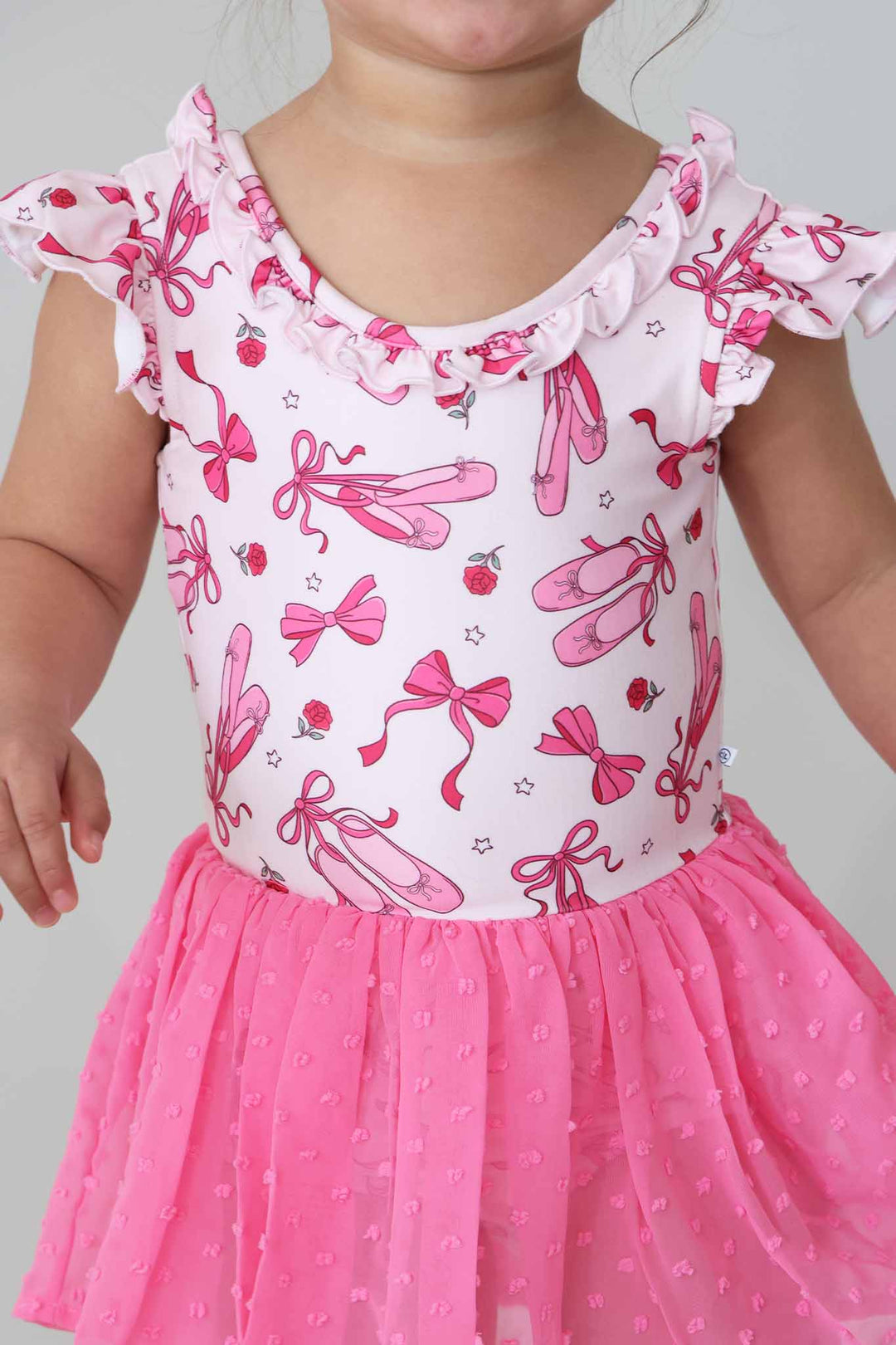 closeup of pink pirouette ballet shoe leotard 