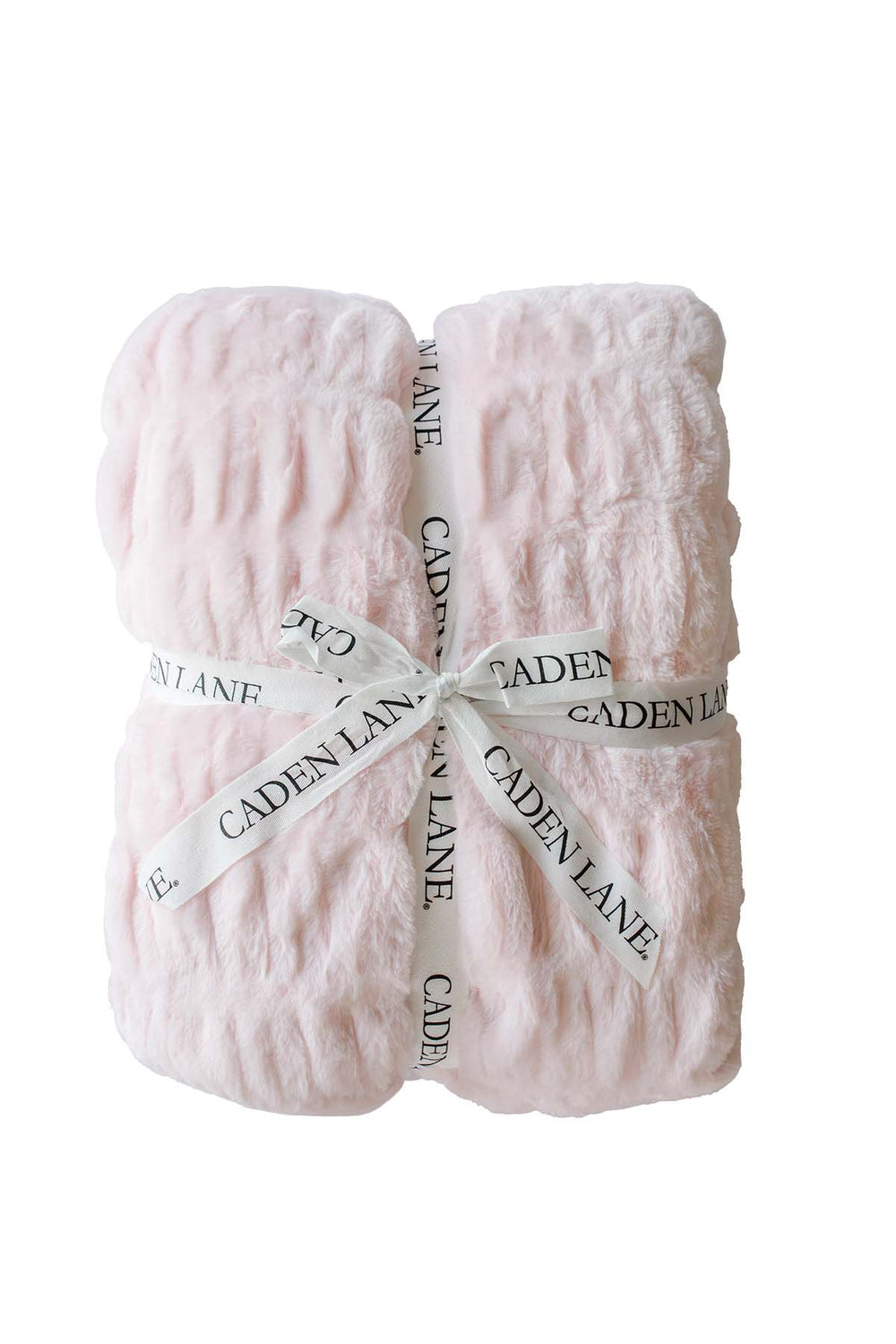Folded double-ruched faux fur baby blanket in barely pink, tied with a Caden Lane ribbon