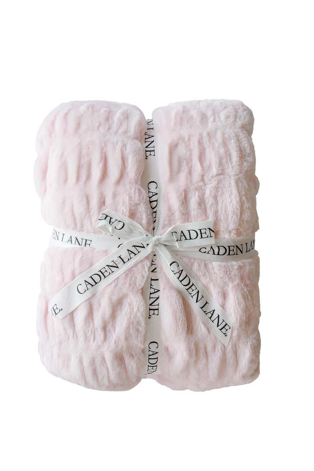 Folded double-ruched faux fur baby blanket in barely pink, tied with a Caden Lane ribbon
